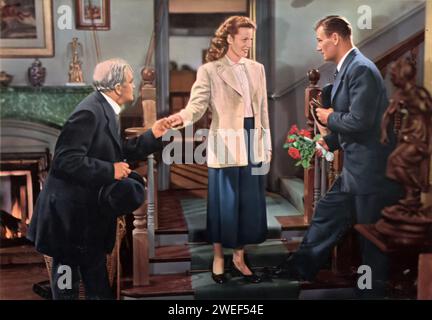 'A portrait of Barry Fitzgerald, Maureen O'Hara, and John Wayne, starring in 'The Quiet Man' (1952). In this beloved romantic comedy-drama, Wayne plays Sean Thornton, an American who returns to his ancestral home in Ireland, while O’Hara portrays Mary Kate Danaher, a fiery and spirited local woman. Fitzgerald adds charm as Michaleen Oge Flynn, the witty and wise local matchmaker. Stock Photo