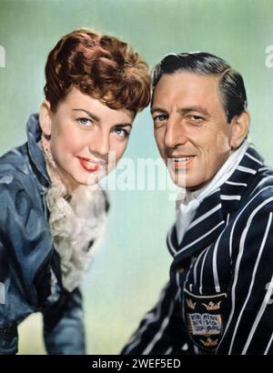 Ray Bolger and Allyn McLerie star in 'Where's Charley?' (1952), a musical comedy film based on the Broadway musical. Bolger reprises his stage role as Charley Wykeham, a charming and scheming student at Oxford University, known for his comedic antics and memorable songs. McLerie plays Amy Spettigue, Charley's love interest, who gets caught up in his humorous and intricate ruse. Stock Photo