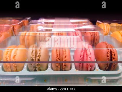 Fresh colored macaroons close-up, sale in coffee shop showcase Stock Photo