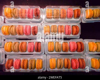 Fresh colored macaroons close-up, sale in coffee shop showcase Stock Photo