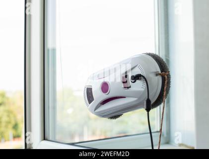 Clean windows safely with a window cleaning robot. Stock Photo