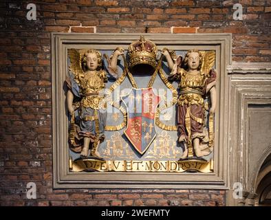 Hampton court Palace  England August 1st 2023Royal coat of arms in Hampton Court Palace,  on the  wall  with  its  painted  gold  red and  blue Stock Photo