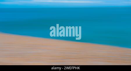 Motion blur along the sea front with the sea and clouds in the background Stock Photo