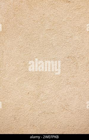 beige stucco wall material texture Stock Photo