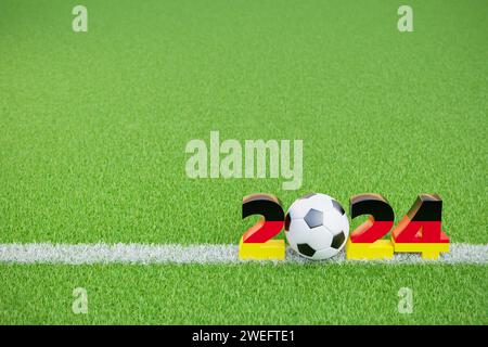 Soccer events in Germany in 2024 concept. A Soccerball within the digits 2 24  colored with the German flag colors on a green grass surface with a cha Stock Photo