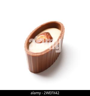 Chocolate candy with almonds on white isolated, close-up. Chocolate praline, sweets. Stock Photo