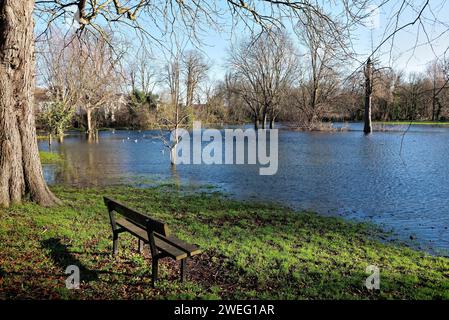 A flooded Manor Park caused by winter storms in Shepperton on a sunny winters day Surrey England UK Stock Photo