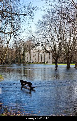 A flooded Manor Park caused by winter storms in Shepperton on a sunny winters day Surrey England UK Stock Photo