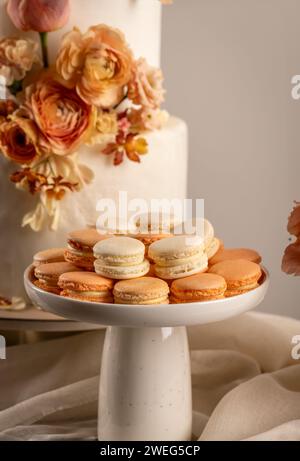 Pastel wedding sweet table setting. Macaron and wedding cake Stock Photo