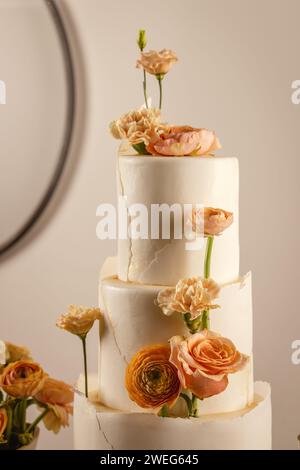 Elegant style wedding cake decorated with flowers. Wedding sweets. Stock Photo