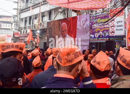 People watch live broadcast of the consecration ceremony of  the Ram temple, in New Delhi, India on 23 January 2024. Stock Photo