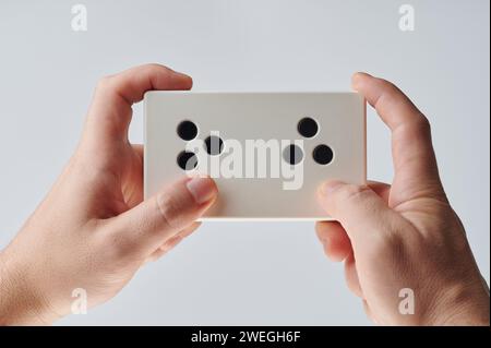 Simple remote controller for RC in hands isolated on white studio background Stock Photo