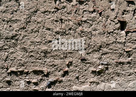 Plastered old clay adobe wall as natural background. Brown stucco ,old wall Stock Photo