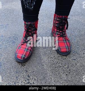 A woman wearing a pair of fashionable tartan boots in Glasgow, Scotland Stock Photo