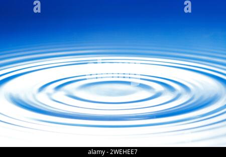 blue water surface with circular waves Stock Photo