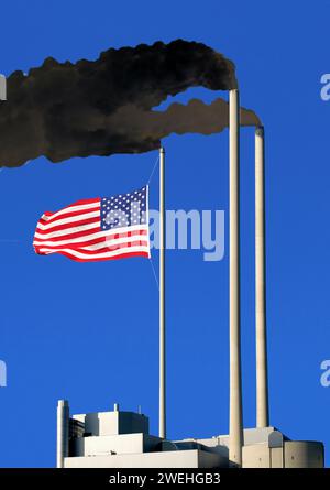 smoking chimneys, dark dirty smoke, a flag of the USA hangs on one of the chimneys like on a flagpole, concept, the original has been heavily modified Stock Photo