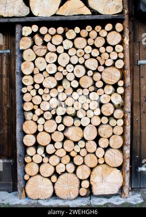 picturesque woodpile, more for decoration, sawn logs, at a wooden hut near Garmisch-Partenkirchen, Bavaria, Germany Stock Photo