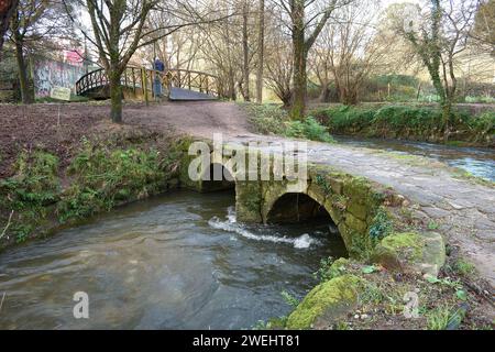 Curved bridge 11 meters long and 25 m wide, oriented in a Northeast-Southwest direction, built in granite perpians and composed of two semicircular ar Stock Photo