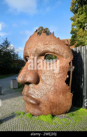 Profile of the mask Bulkhead sculpture / statue by artist Rick Kirby made with mild steel, The Friars, Canterbury, Kent, England, UK.  Public artwork Stock Photo