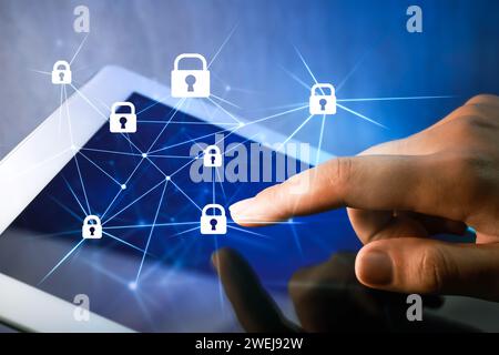 Privacy protection. Woman using tablet on color background, closeup. Digital scheme with padlocks over device Stock Photo