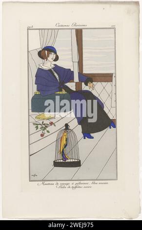 Journal of ladies and fashions: The Fashion Illustrators, 1913  Woman in a blue travel cloak with pelerines on a black taf side dress. She is in a train compartment with a travel bag, a book and some flowers next to her on the couch. In the foreground a parrot in a bird cage. Print from the fashion magazine Journal des Dames et des Modes (1912-1914).  paper engraving fashion plates. coat (+ women's clothes). coat (MANTEAU DE VOYAGE) (+ women's clothes). head-gear: hat (+ women's clothes). dress, gown (+ women's clothes). flowers. bag (HANDBAG) (+ women's clothes). ornamental birds: parrot. bir Stock Photo