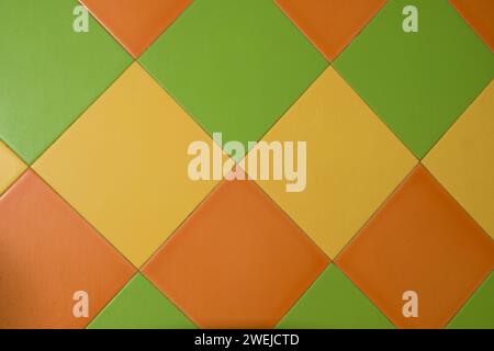 Background of rectangular tiles in a triangle of green, yellow, orange horizontally Stock Photo