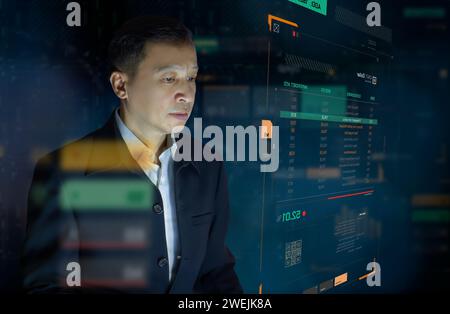 Businessman in front of modern digital virtual touch screen analysing on investment risk management and return on investment analysis or business perf Stock Photo