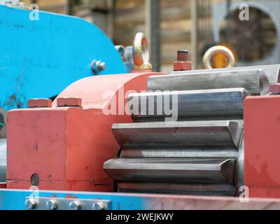 Heavy duty transmission gear of a twin screw press for pressing of animal and fish byproducts. Stock Photo