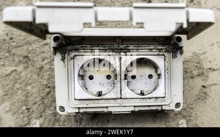 Detail of an old electrical socket outdoors Stock Photo