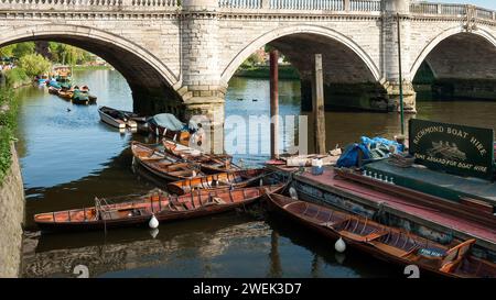 RICHMOND-UPON-THAMES, LONDON, UK - MAY 24, 2010:  Traditional wooden rowing boats on the River Thames Stock Photo