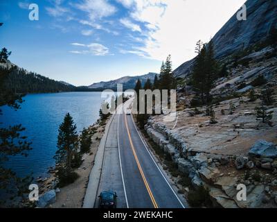 Aerial view of a scenic road alongside a tranquil waterfront Stock Photo