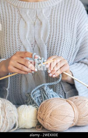 Close-up of hands knitting using circular needles. Stock Photo