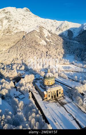 Aerial view of the dome of the upper basilica of the Sanctuary of Oropa in winter at sunrise. Biella, Biella district, Piedmont, Italy, Europe. Stock Photo