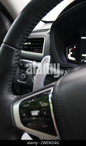 Gear shifter and headlight control lever under steering wheel of modern car Stock Photo