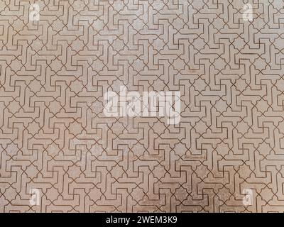 Alhambra in Granada, Spain, Andalusia. Detail of a 800 years old carved stone wall in islamic style, geometric pattern Stock Photo