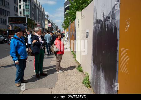 Tourists sightseeing checkpoint charley Berlin Germany Stock Photo