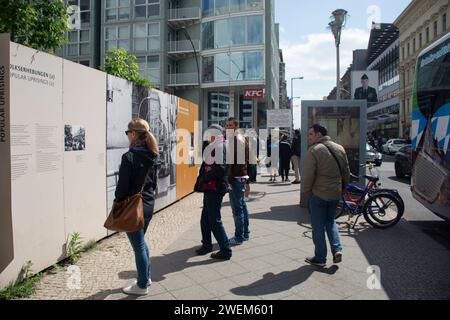 Tourists sightseeing checkpoint charley Berlin Germany Stock Photo