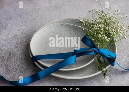 Table setting with fresh Gypsophila flowers Stock Photo