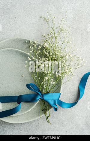 Table setting with fresh Gypsophila flowers Stock Photo