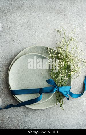 Table setting with fresh Gypsophila flowers Stock Photo