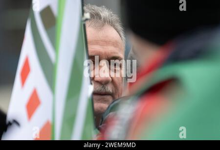Dresden, Germany. 26th Jan, 2024. Claus Weselsky, Chairman of the German Train Drivers' Union (GDL), speaks to GDL members at a rally in front of the main station. The German Train Drivers' Union (GDL) has called for another strike at Deutsche Bahn lasting several days. It is the fourth and by far the longest industrial action in the ongoing wage dispute at Deutsche Bahn. Credit: Robert Michael/dpa/Alamy Live News Stock Photo
