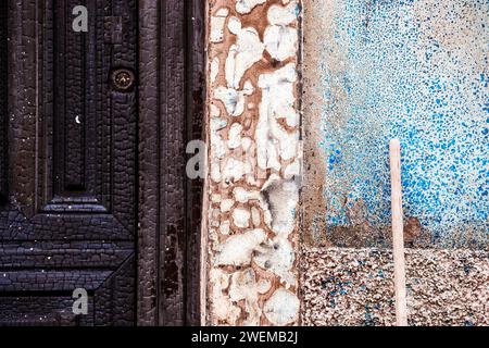 Broom tail leaning on the burned wall in the old town of Villajoyosa Stock Photo