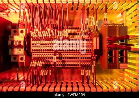 Multiple wires plugged into electronic junction Stock Photo