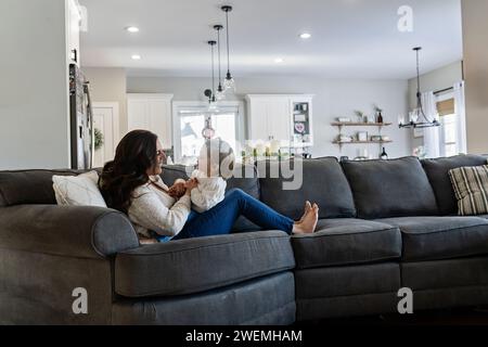 Mother and Baby Girl Playing and Laughing Stock Photo
