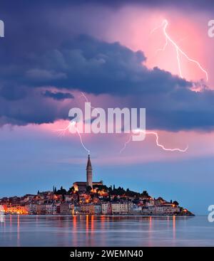 Lightning and storm clouds over the city of Ravinj on the Istrian Peninsula in Croatia. The town is also know by its Italian name of Rovigno. Stock Photo