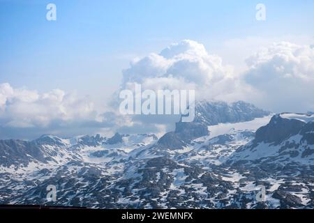 Amazing mountains panorama from 5 Fingers viewing platform in the shape of a hand with five fingers on Mount Krippenstein in the Dachstein Mountains Stock Photo