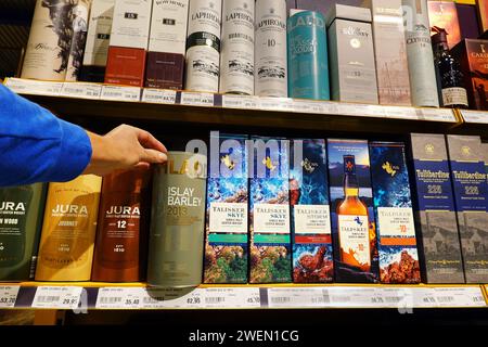 Bottles of whiskey in luxury cardboard packaging Stock Photo