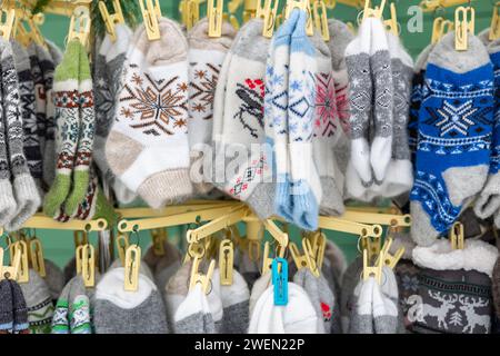 hand knitted socks with Ukrainian ornaments for sale on clothesline, Stock Photo
