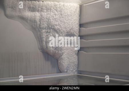 Frozen refrigerator that needs to be defrosted.  Stock Photo