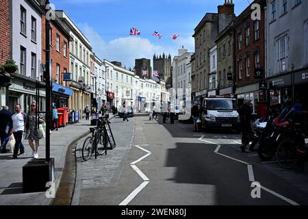 Warm spring day in Wells, Somerset along the highstreet Stock Photo